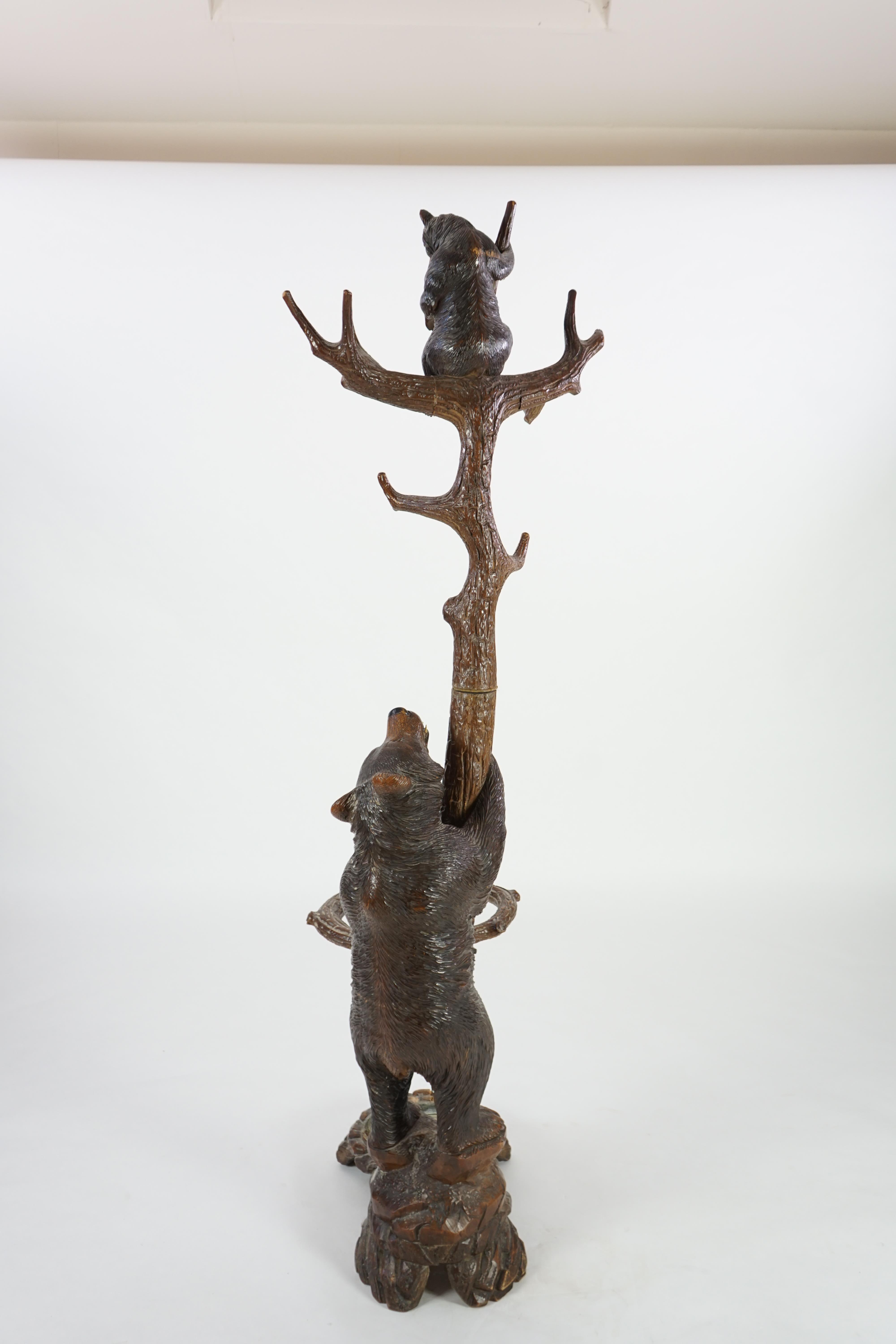 A 19th century Black Forest carved wood bear and cub hall stand